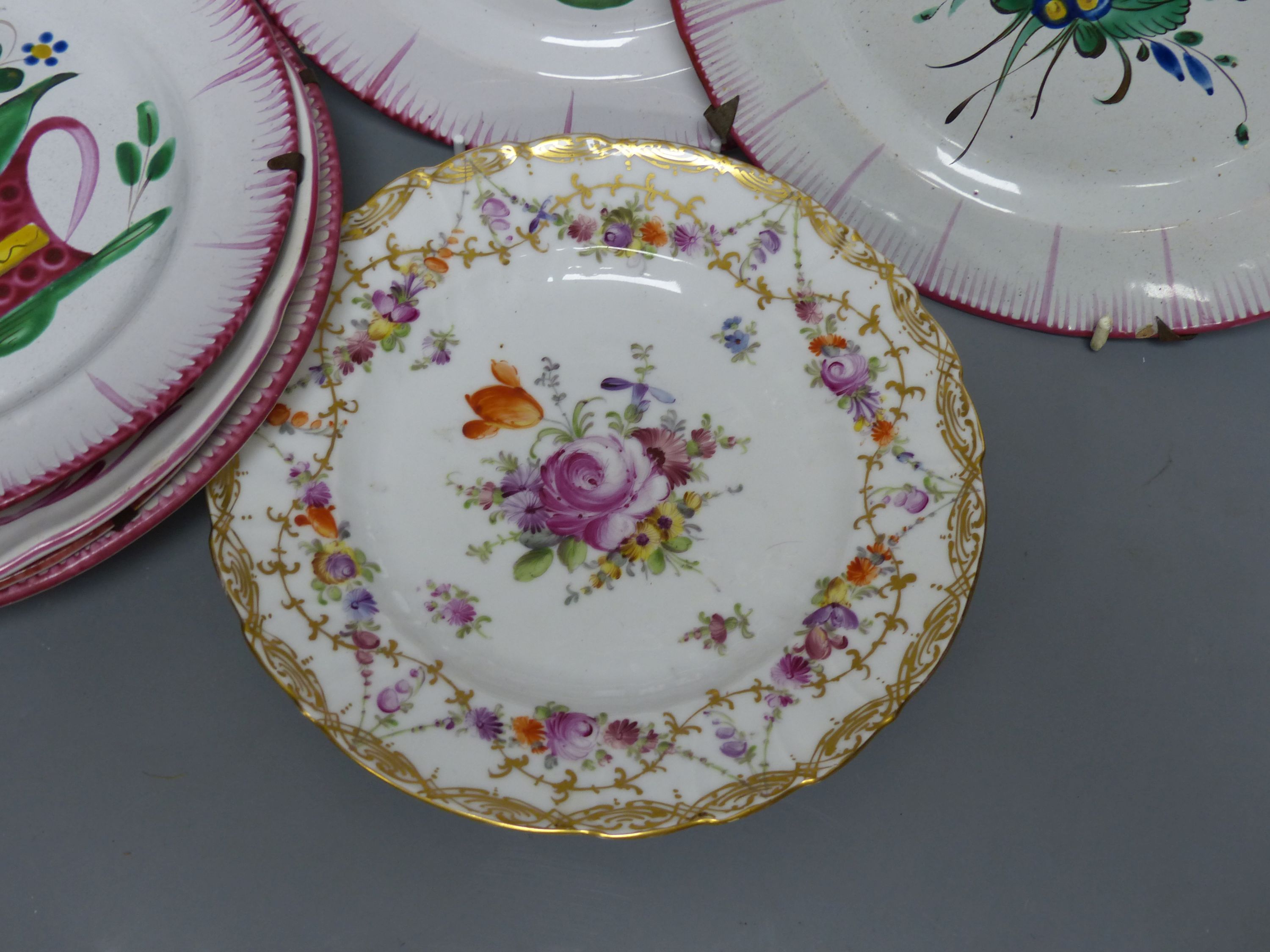 Seven French faience plates and a Dresden plate